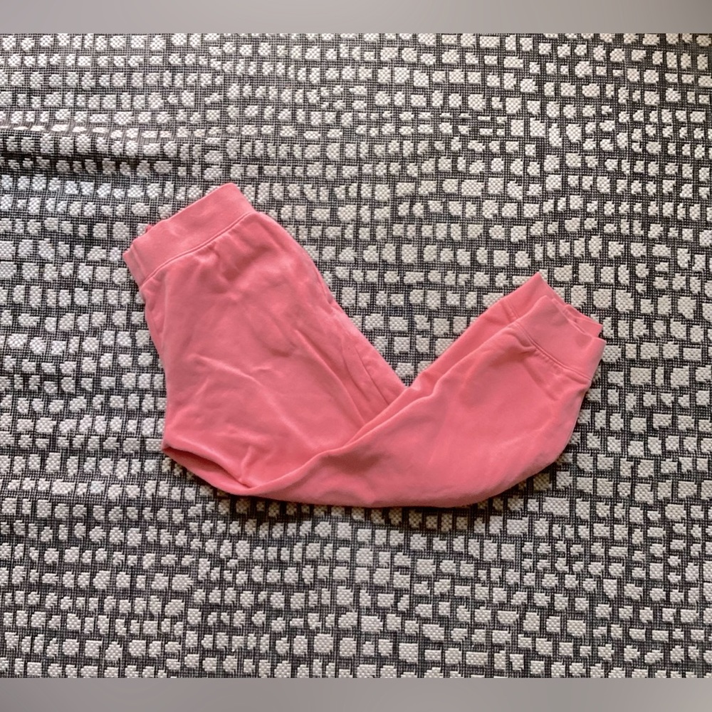 Nike pink sweatpants with the jaw strings on the inside of the pants